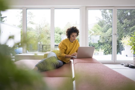 person using an html tooltip on a laptop at home