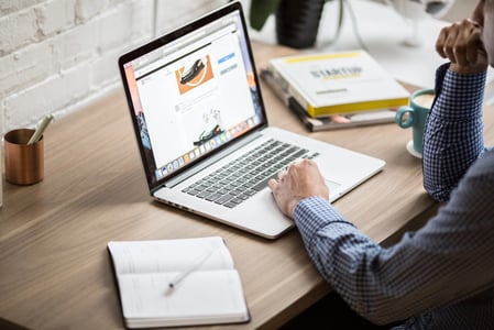 person planning a website redesign on a laptop